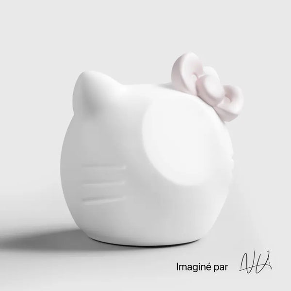 White ceramic cat figurine with a pink bow, designed by Craft Kittiesfr.