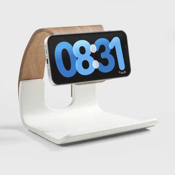 White and wood phone charging stand with a digital clock display