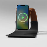 Natural wood MagSafe phone charging stand with a sleek black base, designed for home and office use.