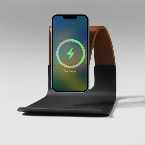 Natural wood MagSafe phone charging stand with a sleek black base, designed for home and office use.