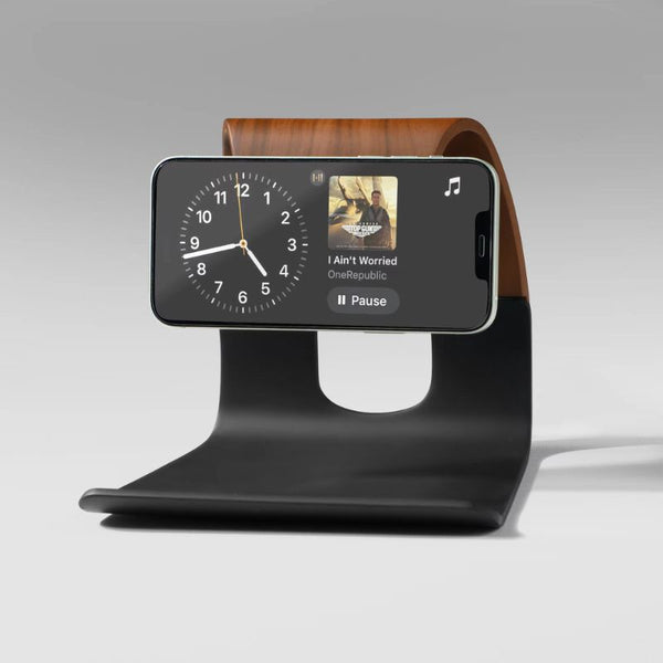 Wooden MagSafe phone charging stand with sleek black base, designed for modern desk and home use.