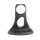 Black phone holder and desk organizer with a sleek design and integrated charging feature by Station de charge
