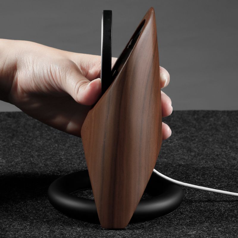 Futuristic wooden charging station with MagSafe compatibility and sleek black base.