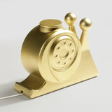 Golden snail-shaped phone charger from Craft Kittiesfr, featuring a unique PopCulture design.