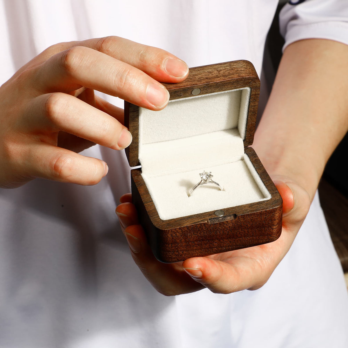 Personalized engraved wooden ring box by Noyer Noir, featuring a single ring compartment and elegant craftsmanship.