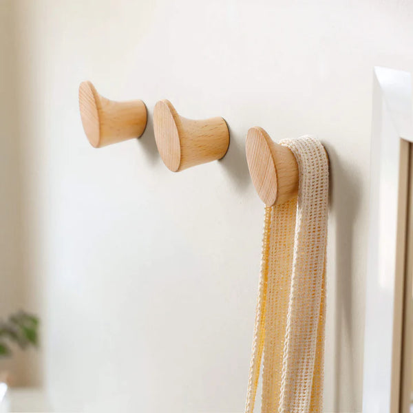 Natural oak wall hooks from Chêne Rouge, perfect for stylish storage and organization.