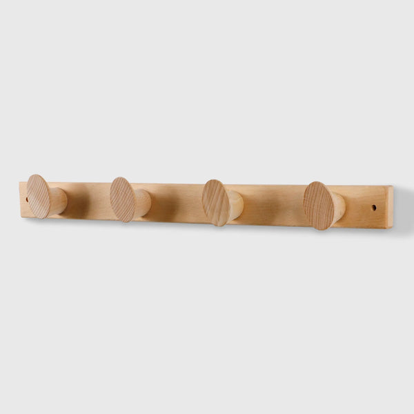 Modern wall-mounted coat rack in natural walnut wood with four round hooks by Frêne.