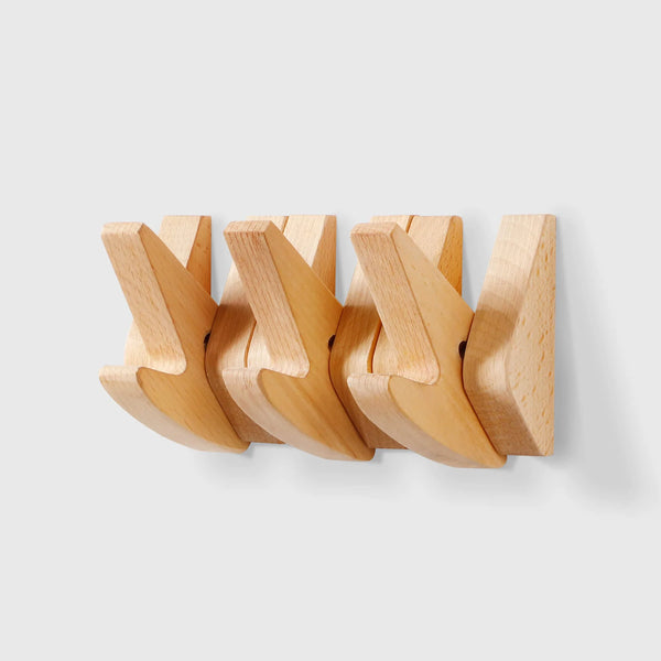 Minimalist solid wood wall hooks by Chêne rouge in natural finish, ideal for interior storage.