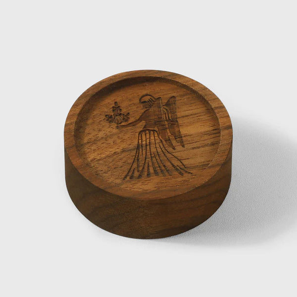 Wooden essential oil diffuser by Noyer noir featuring engraved design, perfect for office aromatherapy and relaxation.