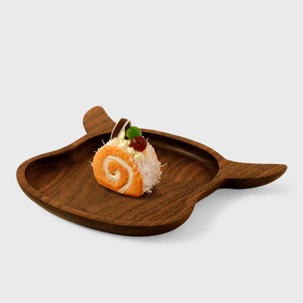 Handcrafted wooden cow-shaped plate by Noyer noir, featuring a smooth finish and unique design, ideal for decorative use.