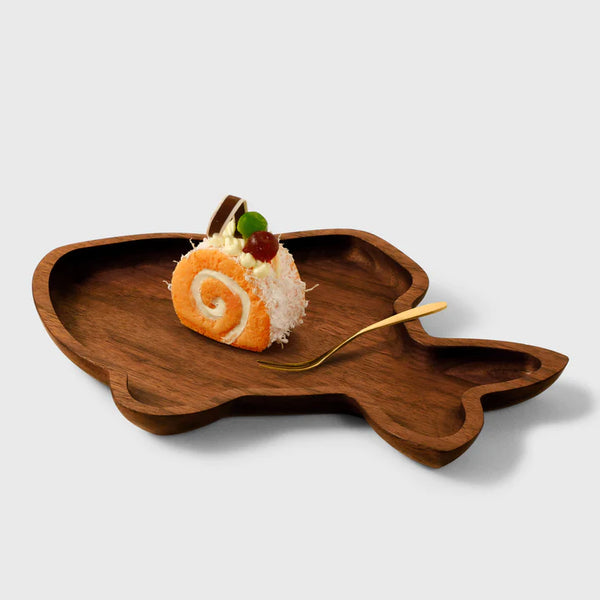 Artisanal wooden fish-shaped plate by Noyer noir, perfect for serving desserts or appetizers.