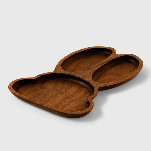 Artisanal wooden bunny-shaped serving plate from Noyer Noir with personalized engraving option.